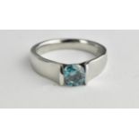 A solitaire aqua coloured diamond ring approx 0.8ct in a platinum curved setting, size