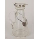 An Edwardian silver mounted glass whisky tot jug by Hukin and Heath Ltd, Birmingham 1913, with
