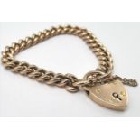A 9ct rose gold curb link bracelet with a heart shaped locket, total weight 31g