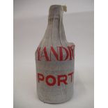 A single bottle of Amandio's 1938 vintage port, in original paper wrapper