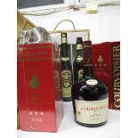 Two bottles of Courvoisier Cognac and a cased set of wine