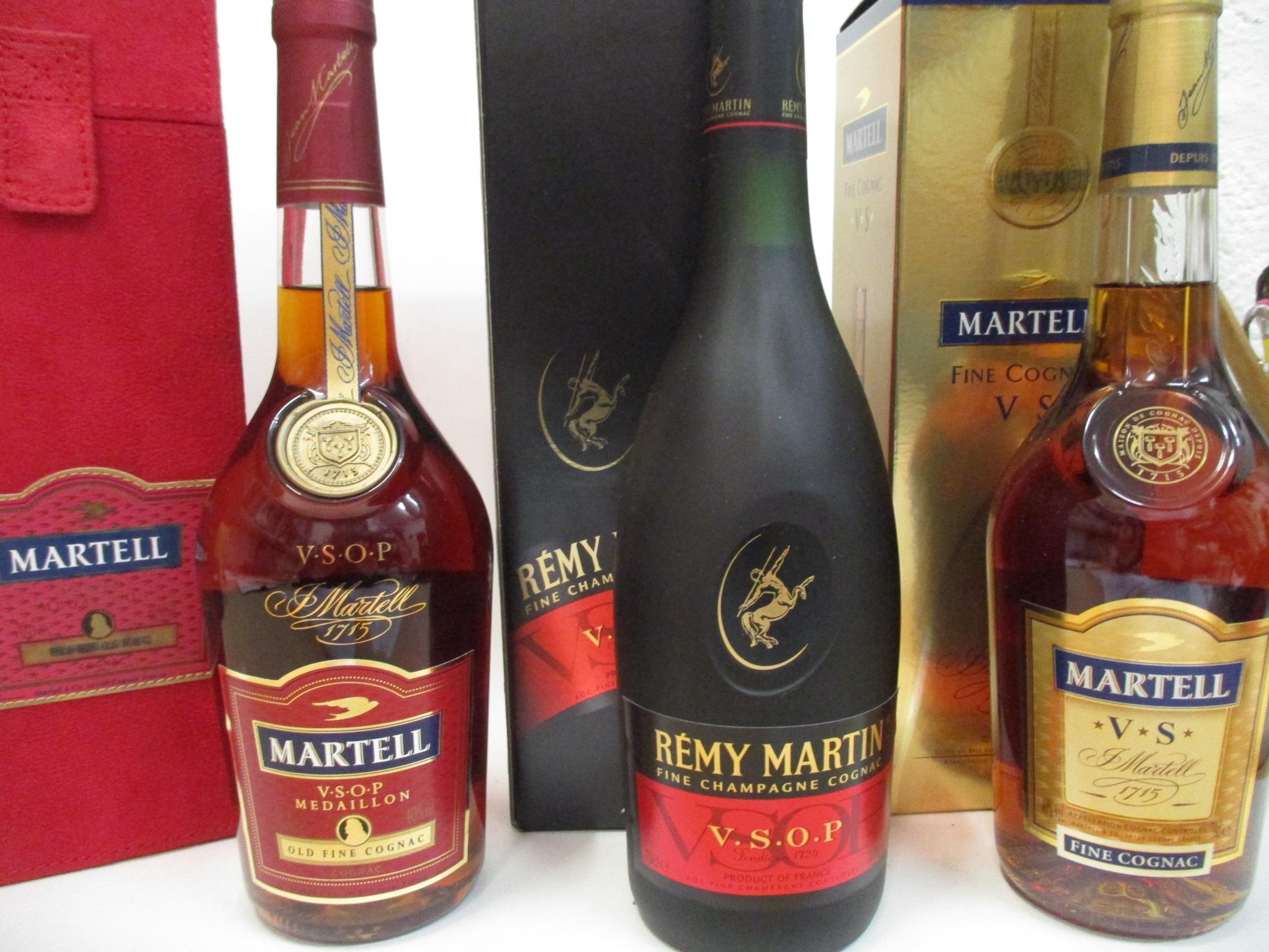 Three bottles of Cognac to include Martell and Remy Martin, 70cl