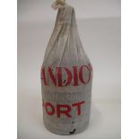 A single bottle of Amandio's 1938 vintage port, in original paper wrapper