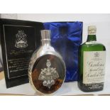 One bottle of Dimple Haig in a pewter overlaid bottle and presentation case 75cl, and a single