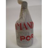 A single bottle of Amandio's 1938 vintage port, in original paper wrapper