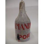 A single bottle of Amandio's 1938 vintage port, in original paper wrapper