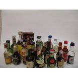 An assortment of 24 miniatures to include Calvados and Chartreuse