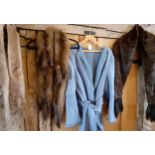 A 1970's pale blue suede open coat with wide wrap-over belt together with 3 vintage fur stoles,