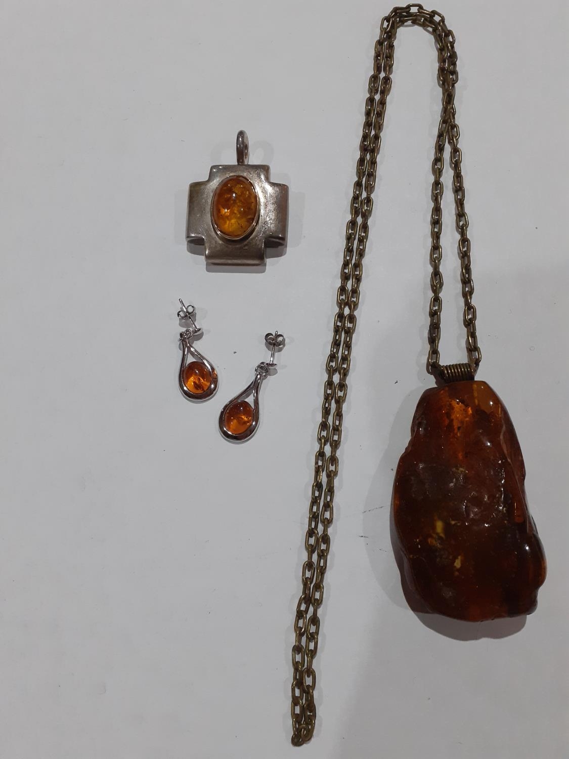 A small quantity of amber and amber effect costume jewellery.