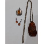 A small quantity of amber and amber effect costume jewellery.