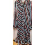 A vintage Balenciaga of Paris sheer tunic dress in a turquoise, red and black geometric design,
