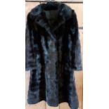 A late 20th Century stranded black mink coat, 32/34" chest x 35" long.