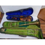 A Sebuer brass trumpet and a child's violin, each in a case Location: