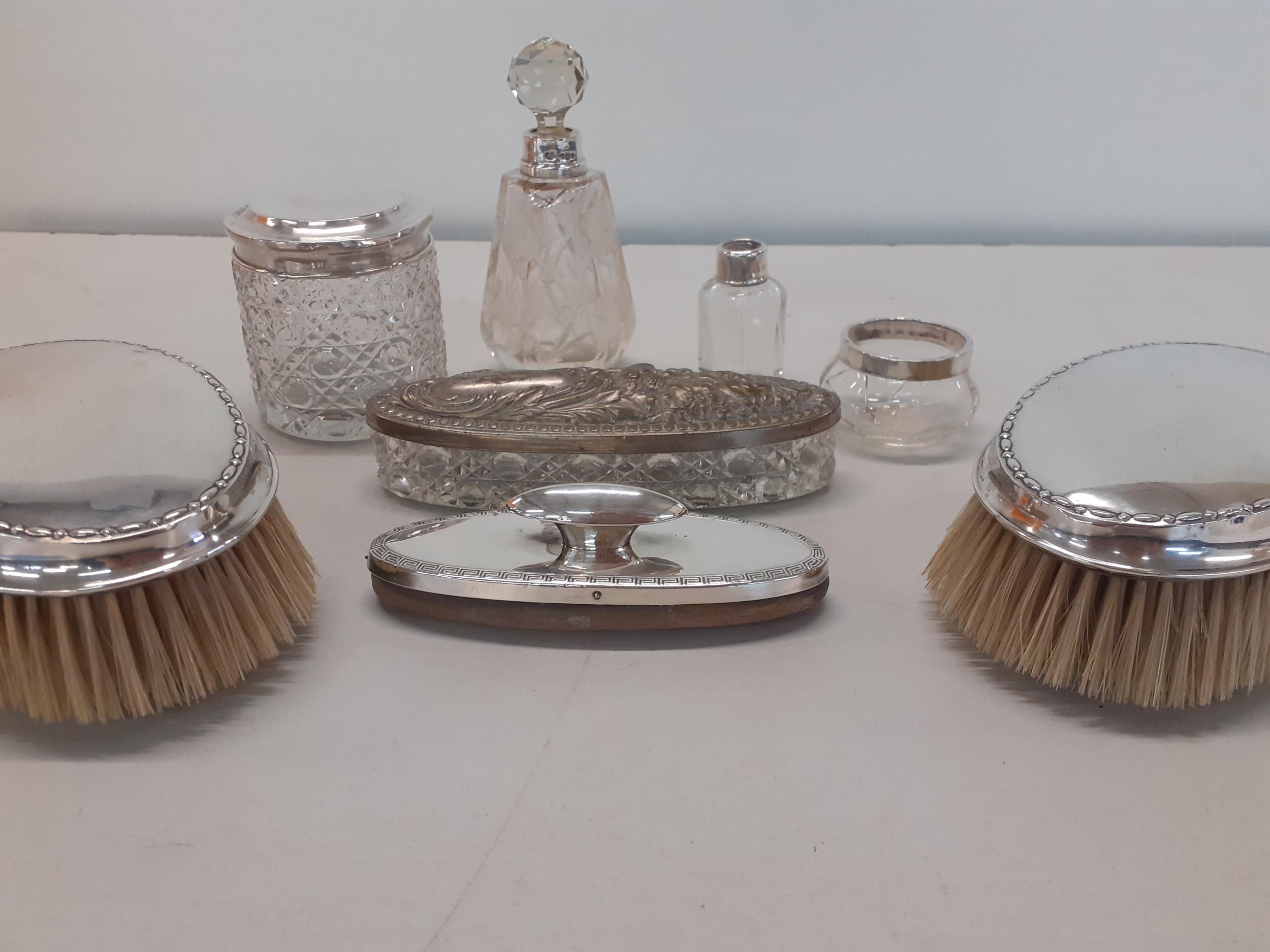 Two silver backed gents hair brushes, a silver nail buffer, silver collared scent bottles, a - Image 2 of 2