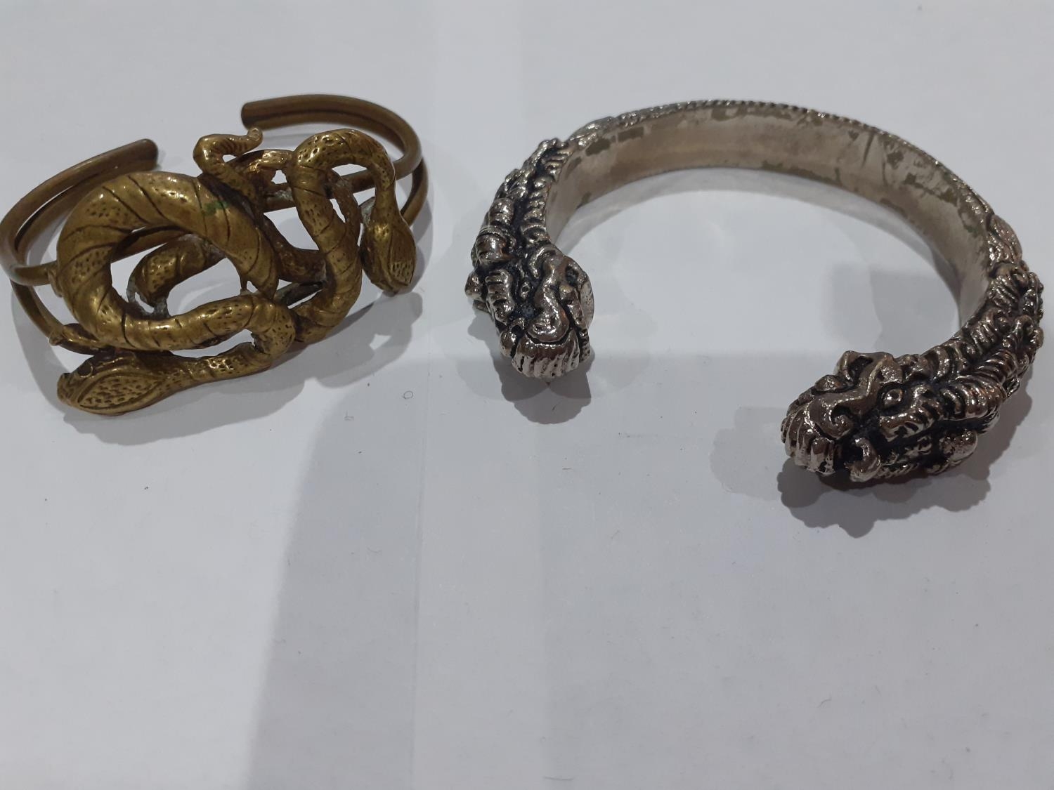 Eastern white metal and silver and other metallic bangles to include ornate bangles with snake, - Image 3 of 12