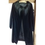A mid 20th Century bespoke black velvet opera coat with black ostrich feather neckline and large