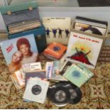 A mixed collection of vinyl records and 45s to include The Beatles, David Bowie, Bob Marley, Jack