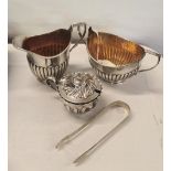 Silver to include a cream jug, sugar and mustard pot, together with a pair of tongs Location: Port