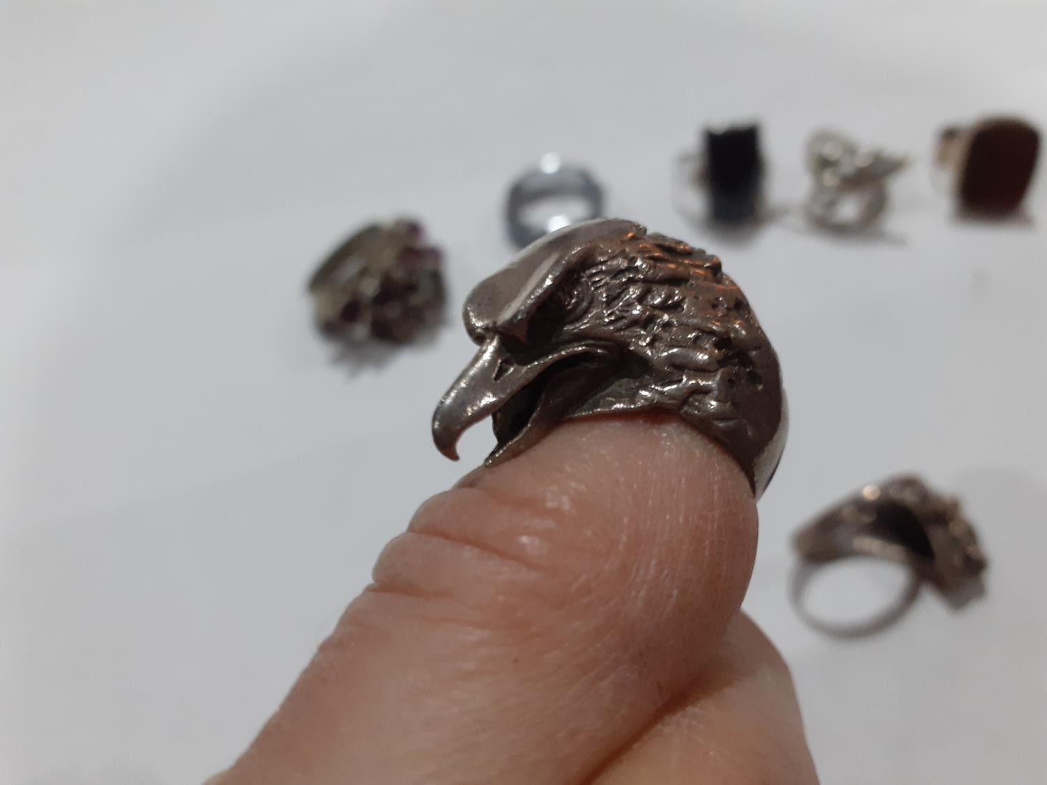 Seven contemporary white metal and silver rings to include one in the form of an eagle's head and - Image 5 of 6