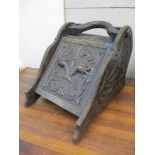 A late 19th century carved oak coal box with dolphin and leaf ornament, 38cm h x 34.5cm w Location: