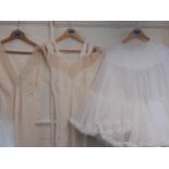 Two ladies cream and lace night gowns and a white tiered underskirt, size small Location: Rail