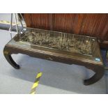 A mid 20th century Chinese opium table with a heavily carved top, 42.5cm h x 114cm w