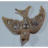 Christian Dior-A vintage gold tone and white stone brooch in the form of a swallow, stamped