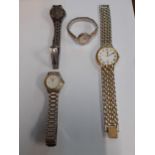 A yellow metal cased ladies Excalibur cocktail watch together with 3 other watches, all modern.