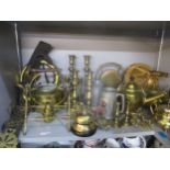 A mixed lot of brassware to include ten kettles, candlesticks, bells, horse brasses and other