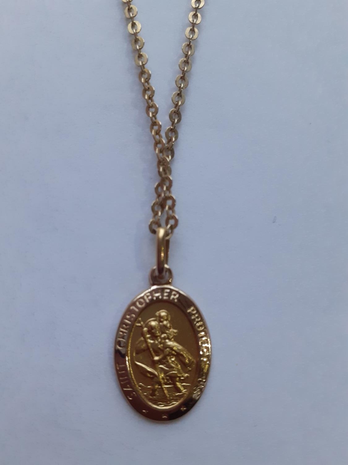 A 10ct gold chain having a 10ct gold St Christopher pendant, 4.0g