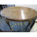 An early 20th century Queen Anne style walnut occasional table of oval form on cabriole legs, a