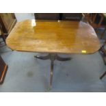 A 19th century pedestal, tilt top table on turned and tapering column and three reeded and splayed