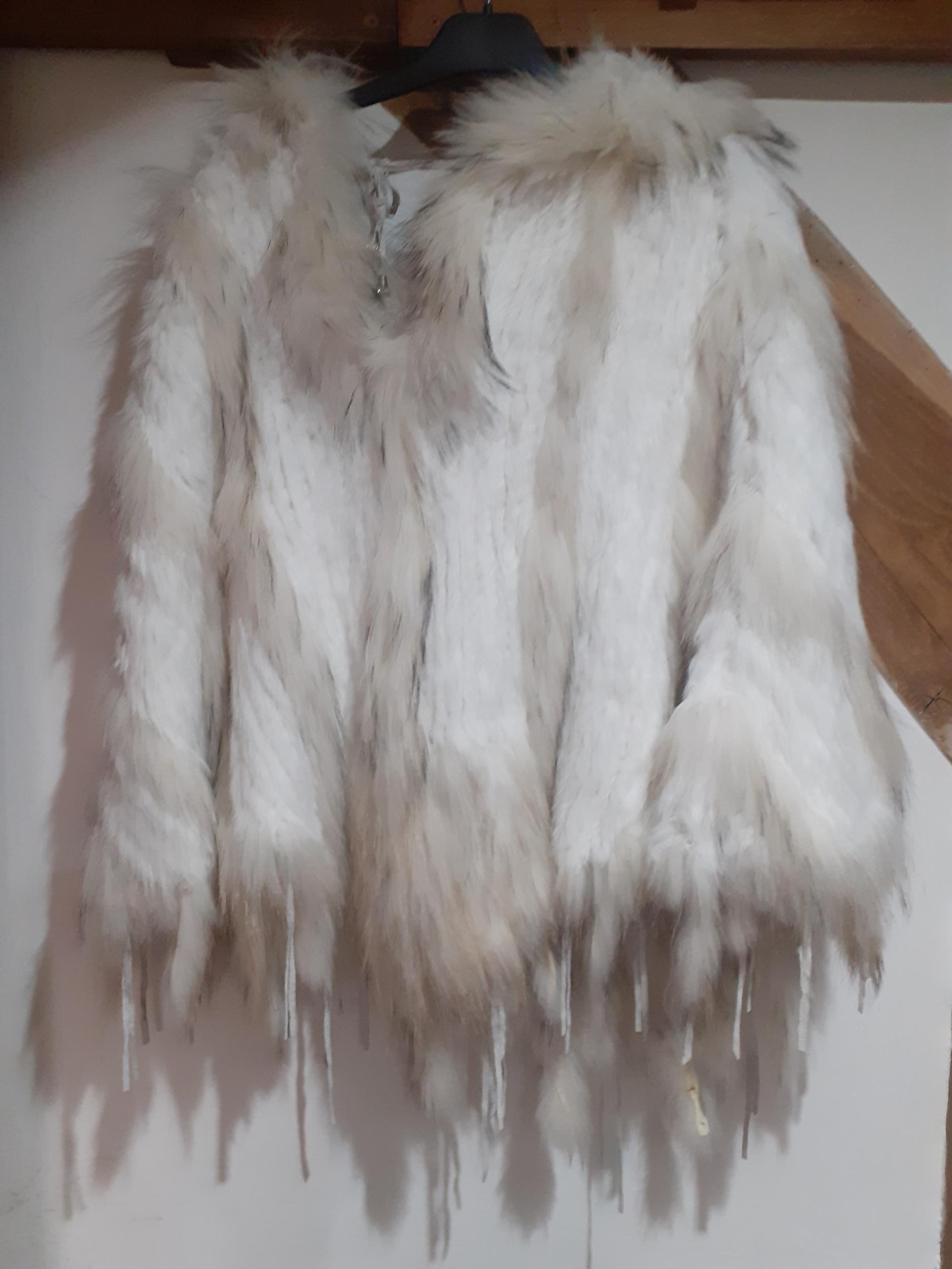 Maclauren-A white and cream short and long haired rabbit fur hooded poncho with cream leather