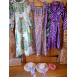 A collection of 1970's Retro clothing comprising a purple 2 piece evening costume with white