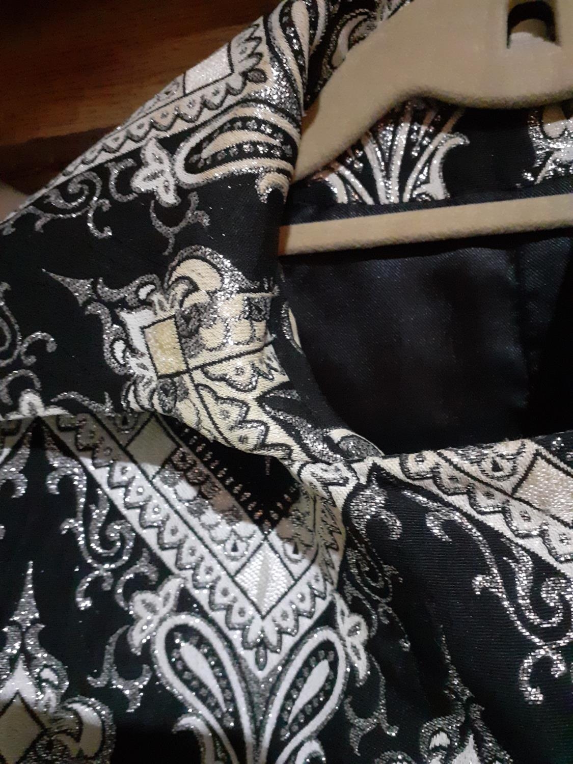 A Retro full length coat having a black ground with white chevron design, silver coloured thread - Image 4 of 4