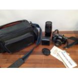 A Minolta 5000 A/F camera with accessories and travel case