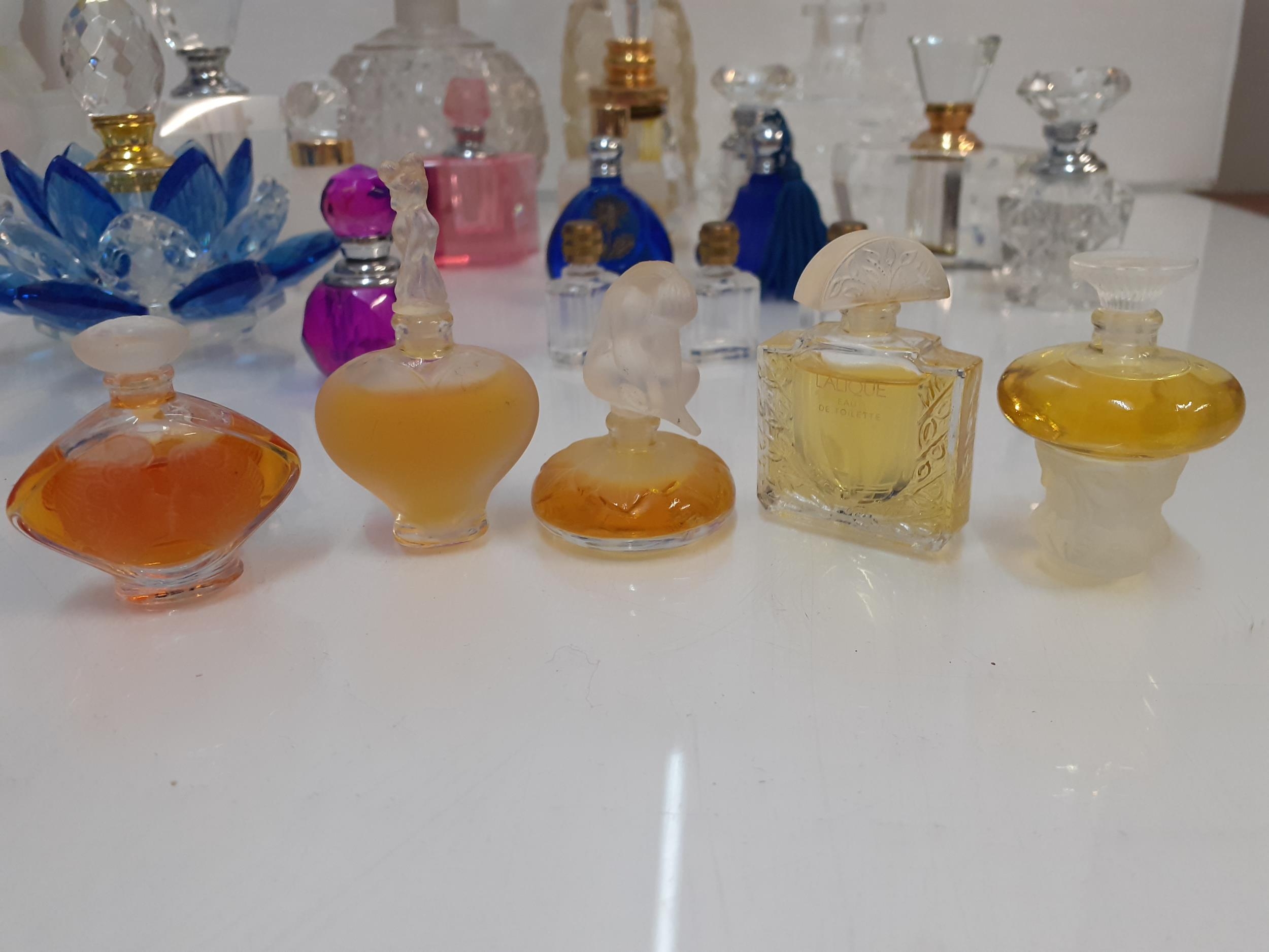 A collection of decorative empty glass perfume bottles to include a silver collared example and - Image 3 of 4