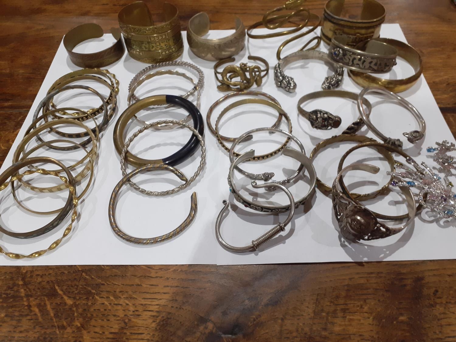 Eastern white metal and silver and other metallic bangles to include ornate bangles with snake, - Image 2 of 12