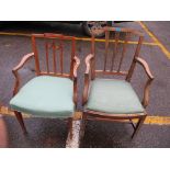 An early 19th century mahogany carver chair, together with an early 20th century carver chair on