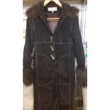 A modern Karen Millen brown suedette coat with brown curly lambs-wool collar and cuffs having bone