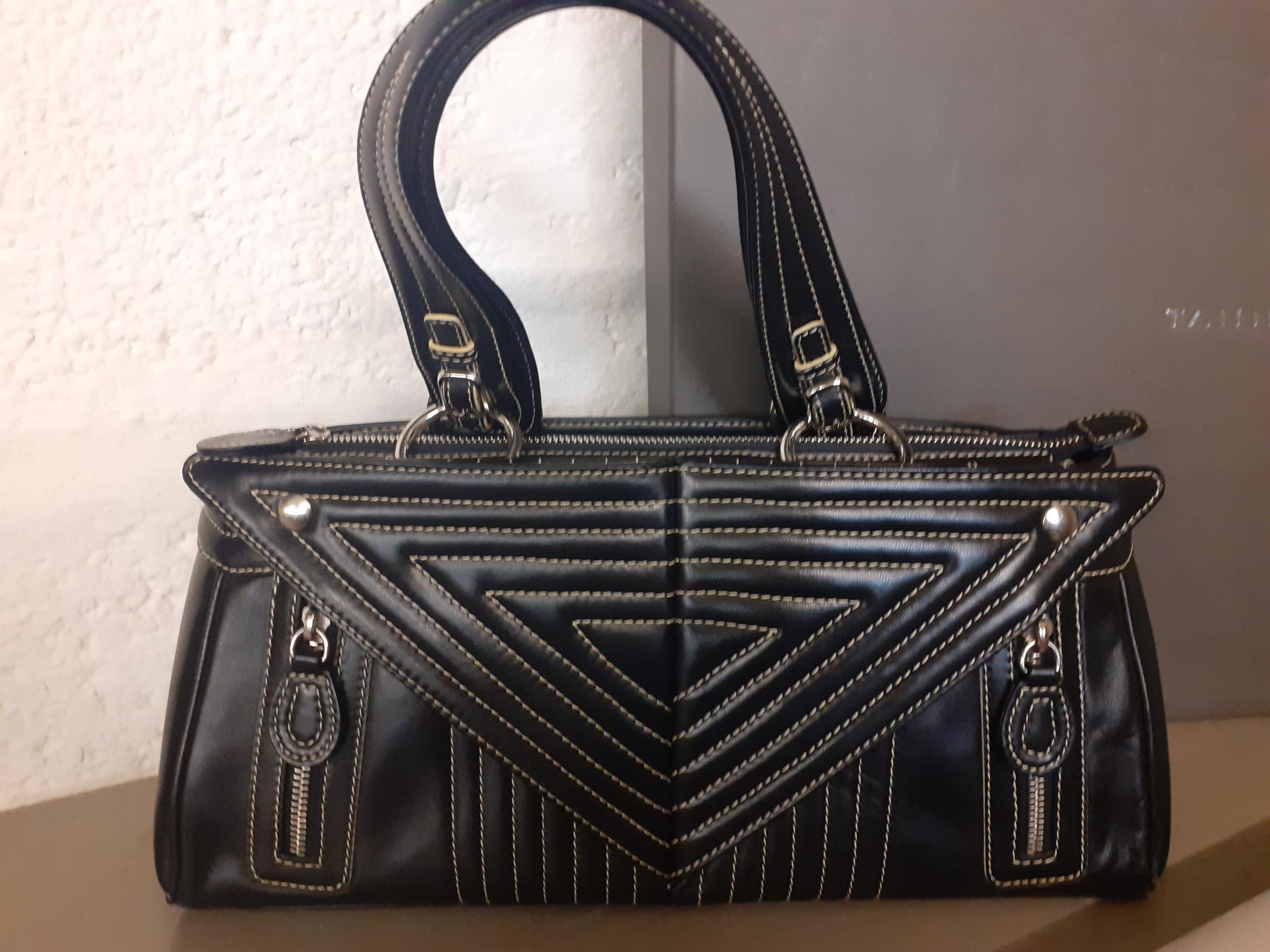 A Tanner Krolle black leather handbag with white stitching in a geometric fashion having silver tone - Image 2 of 4