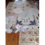 A large mid 20th Century cream cotton tablecloth with hand embroidered sections of blue and gold sea