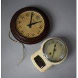 A Smiths 8 day Bakelite Framed Circular Wall Clock Together with an Enfield Swing Pendulum Wall