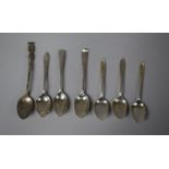 A Collection of Various Silver Spoons to Include Three Matching Teaspoons, One Single Example, Two