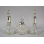 A Collection of Three SIlver Mounted Perfume/Scent Bottles to Include Pair of Bottle Form, 15cm high