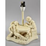 A Figural Table Lamp Base, Gents Having a Drink, 26cm High
