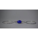 A Silver Bracelet with Oval Blue Cabochon Together with Two Other Bangles