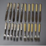 A Set of Mother of Pearl and Silver Banded Fish Knives and Forks Together with a Bone Handled