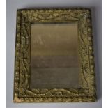 A Small 19th/Early 20th Century Rectangular Gilt Framed Mirror with Floral Swag Decoration in