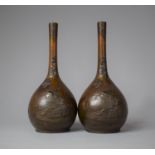 A Pair of Bronze Meiji Period Japanese Bottle Vases, with Samurai Decoration in Relief, 21cm High